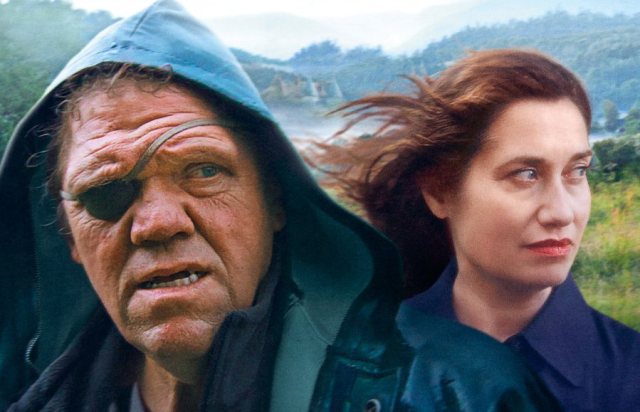 Détail de l'affiche, sur les visages de deux personnages : un homme borgne au physique grotesque, et une belle femme.